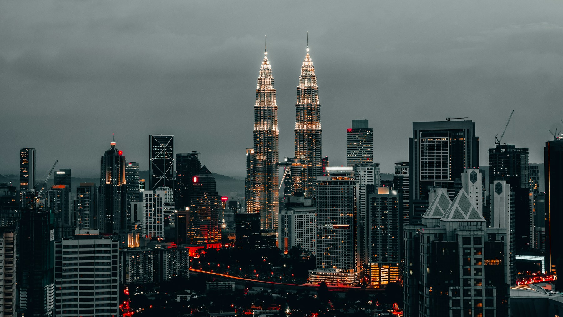 Petronas Twin Towers and Kuala Lumpur skyline at night
